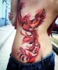 Multicolored-rising-phoenix-tattoo-on-girl-side-back.jpg
